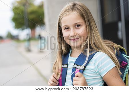A nine years old girl student at school