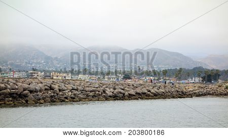 VENTURA CA USA - JULY 4 2013: People enjoying a trip to the beach near Ventura harbor durig 4th of July holiday city of San Buenaventura Southern California