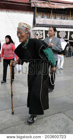 People Walk Around Jokhang Temple In Tibet