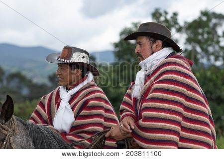 June 3 2017 Machachi Ecuador: cowboys in traditional wear on horseback in the Andes