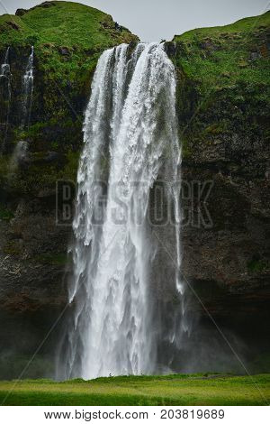 famous Seljalandsfoss waterfall in southern Iceland. treking in Iceland. Travel and landscape photography concept