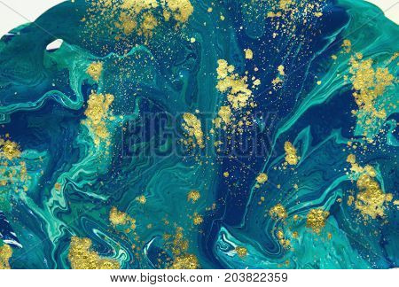 Marbled abstract background. Liquid marble pattern. Colorful marble backdrop. Golden glitter texture