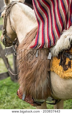 June 3 2017 Machachi Ecuador: closeup traditional chaps and poncho cowboy wear in the Andes