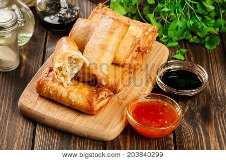 Spring Rolls With Chicken And Vegetables On Chopping Board
