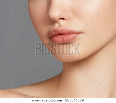 Sexy Plump Full Lips. Close-up Face Detail. Perfect Natural Lip Makeup. Close Up Photo With Beautifu