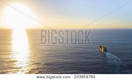 GOLD COAST, AUSTRALIA - SEPTEMBER 10 2017: Balder R Hopper Dredger heading towards sunrise on the open sea's