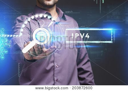 Business Technology Internet and network concept. Young businessman working on a virtual screen of the future and sees the inscription: IPv4