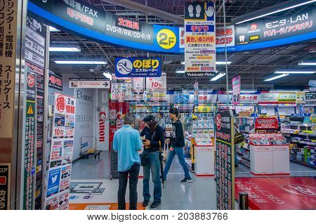 TOKYO, JAPAN JUNE 28 - 2017: Unidentified people in the enter of Yodobashi Camera department store. Yodobashi Camera is a chain store mainly selling electronic products with 21 stores in Japan.