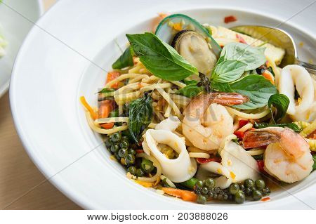Spaghetti Sea food Drunkard Spicy delicious Thai food on white dish