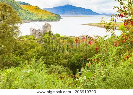 Dornie Scotland - August 2014: Eilean Donan Castle is located in a strategic position at the confluence of three fjords. In August tourists visit it because it is known as the set of one of James Bond's films