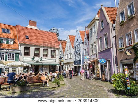 BREMEN, GERMANY - AUGUST 23, 2017: Colorful little shops in the historic Schnoor district of Bremen, Germany