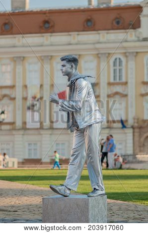 TIMISOARA, ROMANIA - September 08, 2017: Portrait of a man in silver costume at the CheckArt Carnival. Living statue. Union Square.