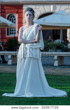 TIMISOARA, ROMANIA - September 08, 2017: Portrait of a woman in white dress at the CheckArt Carnaval. Living statue. Union Square.