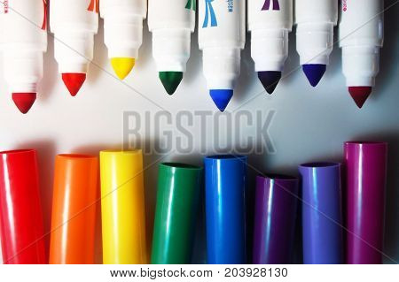 Flat lay shot of an array of colorful markers.