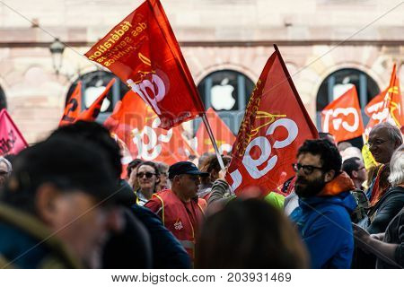 STRASBOURG FRANCE - SEPT 12 2017: General Confederation of Labour flags at political march during a French Nationwide day of protest against the labor reform proposed by Emmanuel Macron Government