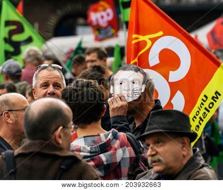 Man Wearing Emmanuel Macron Mask At Protest
