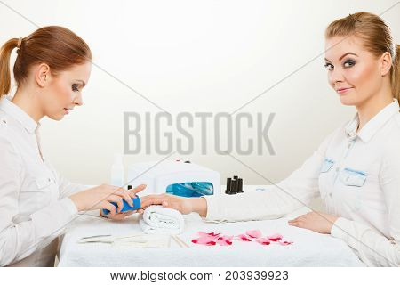 Beautician With Client At Beauty Salon.