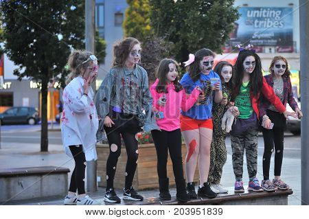 Girls With Hallowen Dress Standing In A Beanch ,eire Square, Galway, Ireland September 2017