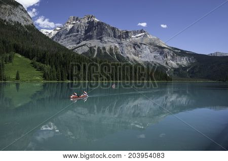 Emerald Lake in Yoho National Park British Columbia Canada with red canoes