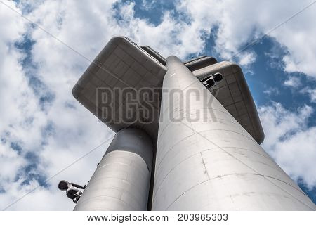 Prague, Czech Republic - August 21, 2017: Zizkov Television Tower in Prague. It is is a  transmitter tower and an example of high tech architecture. Low angle view a cloudy day of summer.