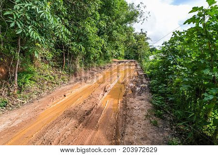 A muddy local road in a rural area at Pa Bong Piang near Inthanon National Park and Mae Chaem Chiangmai Thailand.