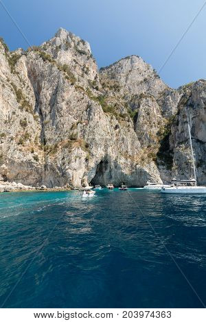 CAPRI ITALY - JUNE 13 2017: Boats with tourists near Grotta Bianca and Grotta Meravigliosa Capri Italy