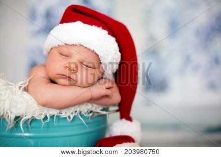 Portrait Of A Newborn Baby Boy,l Wearing Christmas Hat, Sleeping