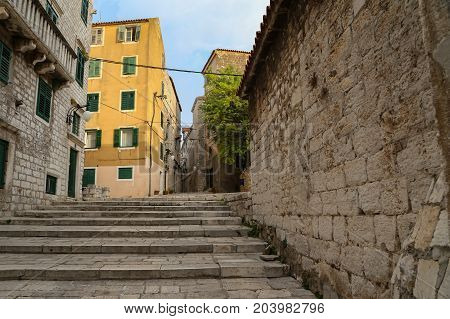 Tourist city by the Adratic sea - Sibenik, Croatia. The old stones, narrow street and stairs.