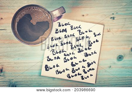 Blog blog blog - blogging concept on a napkin with cup of espresso coffee