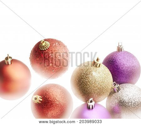High key light effect on a colorful christmas balls set. White background and copy space