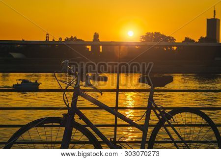 Cycling In Sunset. Lifestyle Concept. Hipster Cycling In Sunset In Countryside. Healthy Lifestyle. P