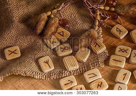 Handmade Scandinavian Wooden Runes On A Wooden Vintage Background. Concept Of Fortune Telling And Pr