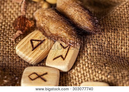 Handmade Scandinavian Wooden Runes On A Wooden Vintage Background. Concept Of Fortune Telling And Pr