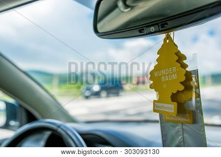 Miercurea Ciuc, Romania- 26 May 2019: Hanging Wunder Baum Air Fresheners On The Mirror, Passing Car 