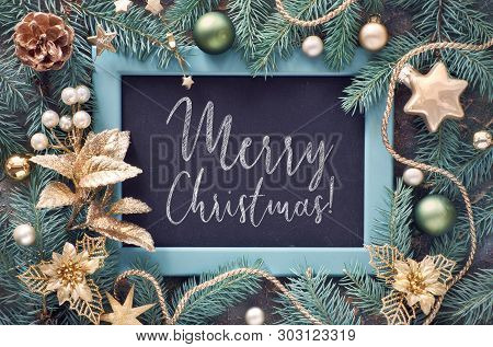 Green And Golden Christmas Background. Decorated Fir Twigs Around Chalk Board On Dark Background. To
