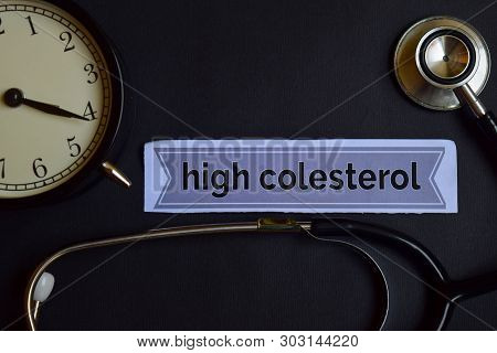 High Colesterol On The Print Paper With Healthcare Concept Inspiration. Alarm Clock, Black Stethosco