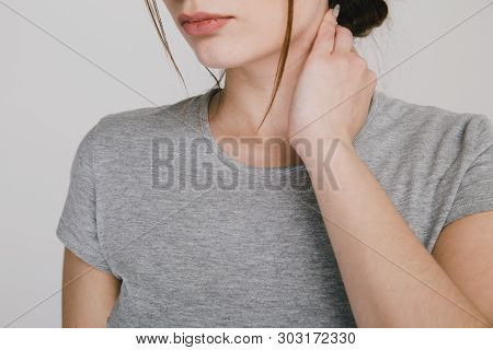 Close Up Picture Of Young Woman With Neckache Isolated.