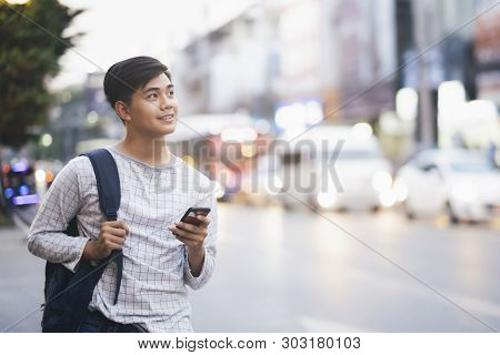 Young Traveler Browsing Gps Online Maps Application.