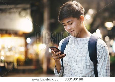 Young Traveler Browsing Gps Online Maps Application.