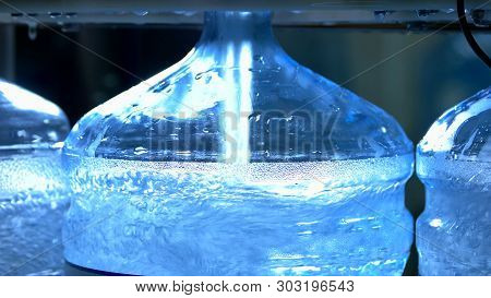 Container Being Filled With Water. Gallons Of Clean Water. Gallon Water Production Line.