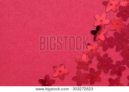 Red Palettes In The Form Of Flowers On A Red Background, A Festive Concept.  Place For Text.