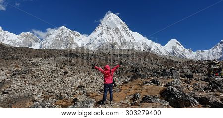 Trekker Hand Up Two Hands With Pumori Mt. And Kala Patthar View From Gorak Shep Village In Backgroun