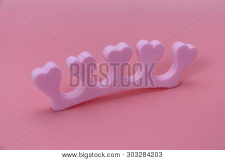 Manicure Separator For Fingers With Hearts On A Pink Background. There Is Not Anyone. A Toe And Hand