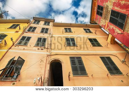 View Of The Colored Yellow And Red Houses Of Riomaggiore, Cinque Terre, Liguria, Italy