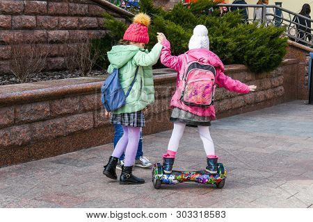 Child On Hover Board. Kids Riding Scooter In Summer Park. Balance Board For Children. Electric Self 