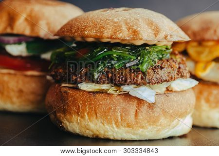 Burger Flyer. Cheese Burger With Grilled Meat, Cheese, Salad And Onion Rings. Close-up Of Delicious 