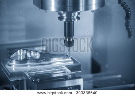 The  Cnc Milling Machine Cutting The Mould Part With The Solid Ball End Mill Tool.the Hi-technology 