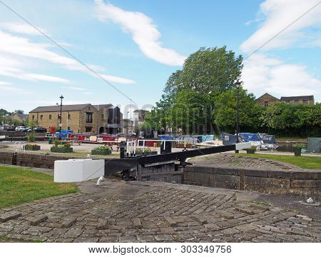 A View Of The Lock Gates At The Entrance To Brighouse Basin And Moorings On The Calder And Hebble Na