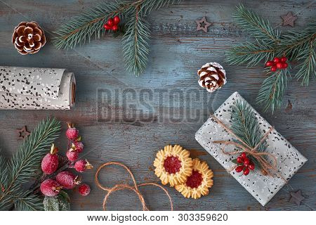 Packing Cookies As Christmas Gifts, Flat Lay With Xmas Decorations, Wrapped Box And Pair Of Cookies 