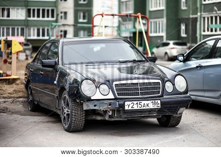 Novyy Urengoy, Russia - May 25, 2019: Abandoned Car Mercedes-benz W210 E-class In The City Street.